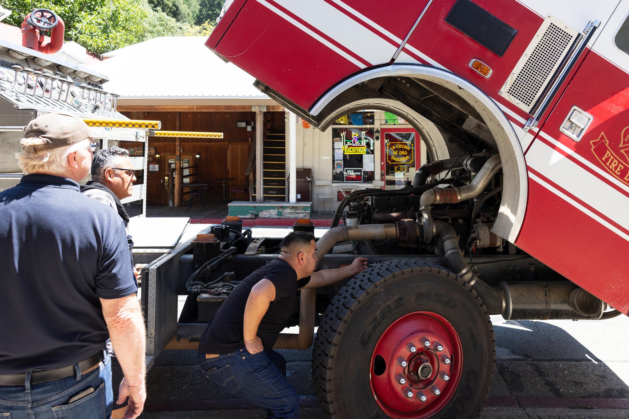 Firefighter and mechanic Jorge Valdez inspects the Downieville engine’s motor.