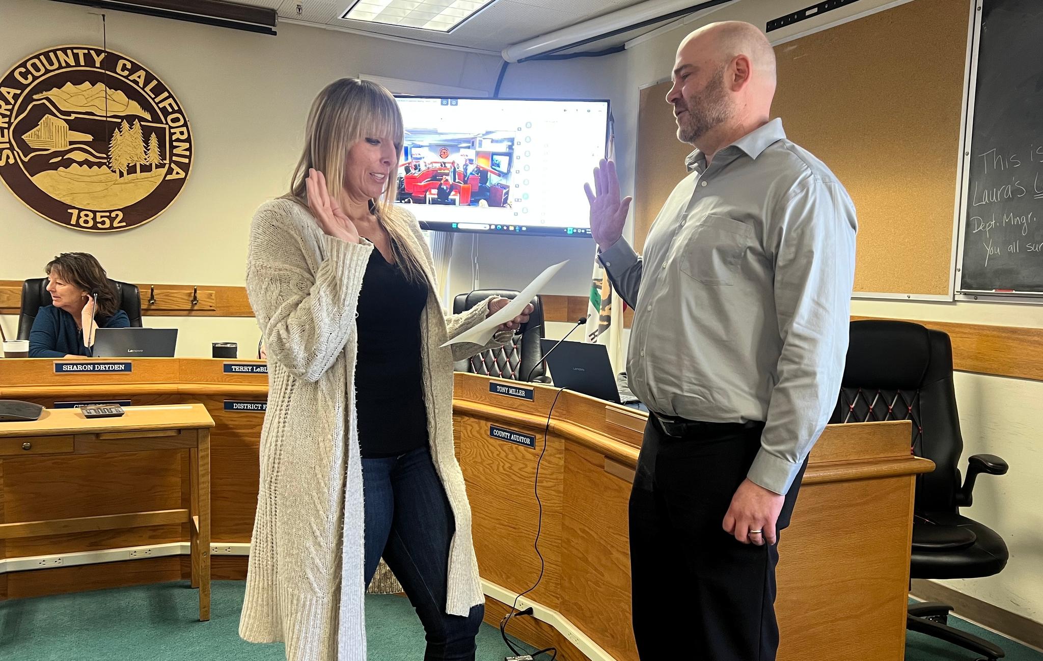 Eric Jackson is sworn in as assessor by Assistant Clerk-Recorder Melissa Kinneer.