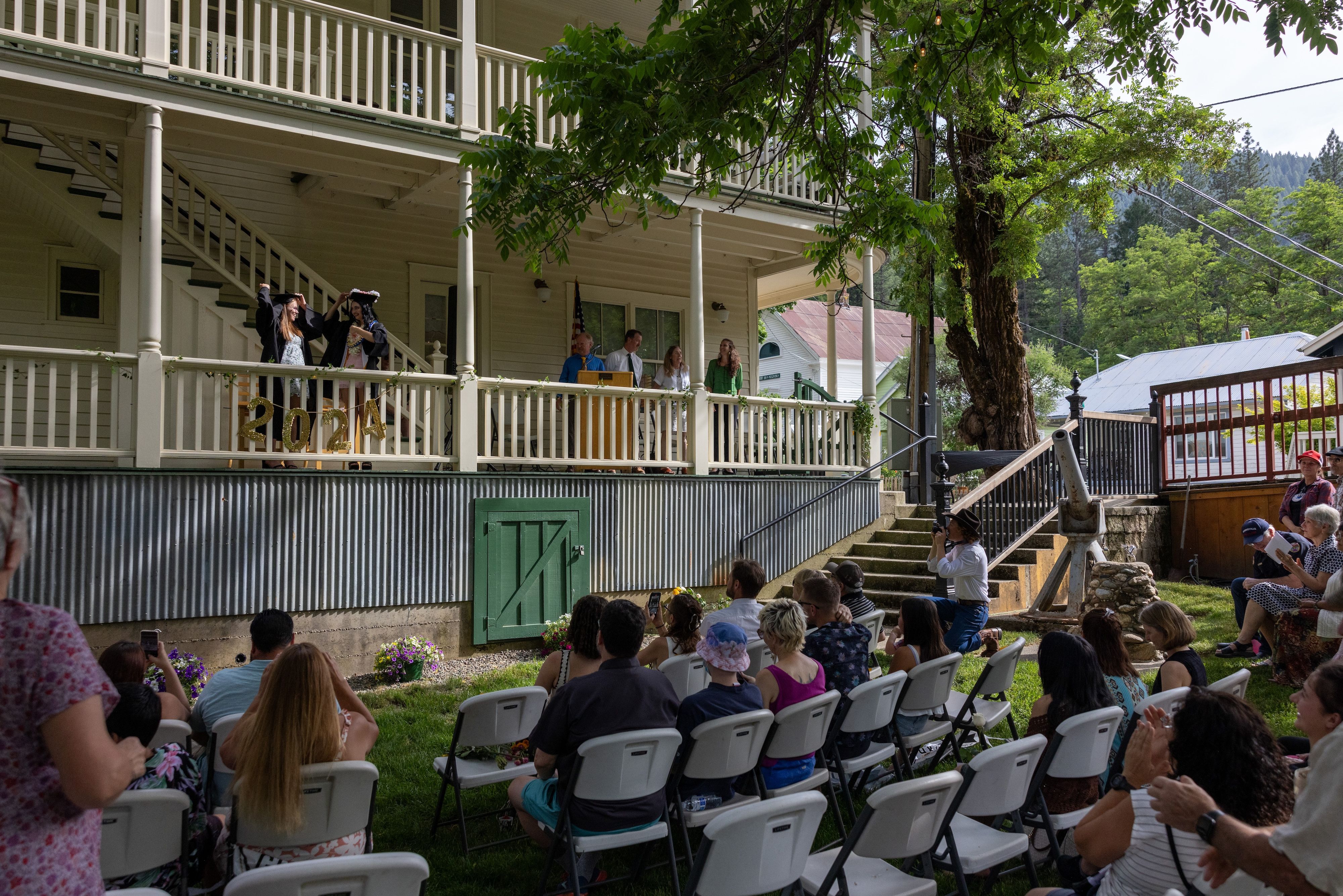 The graduates prepare to throw their caps