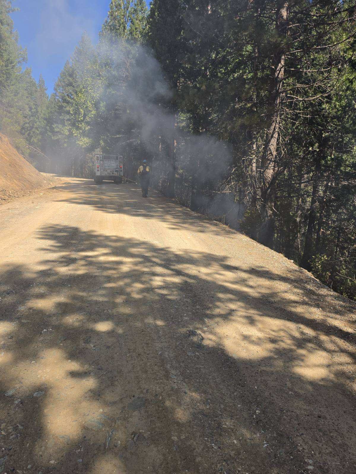 Smoke from the fire was visible along Squirrel Creek Road. Photo by Plumas National Forest.