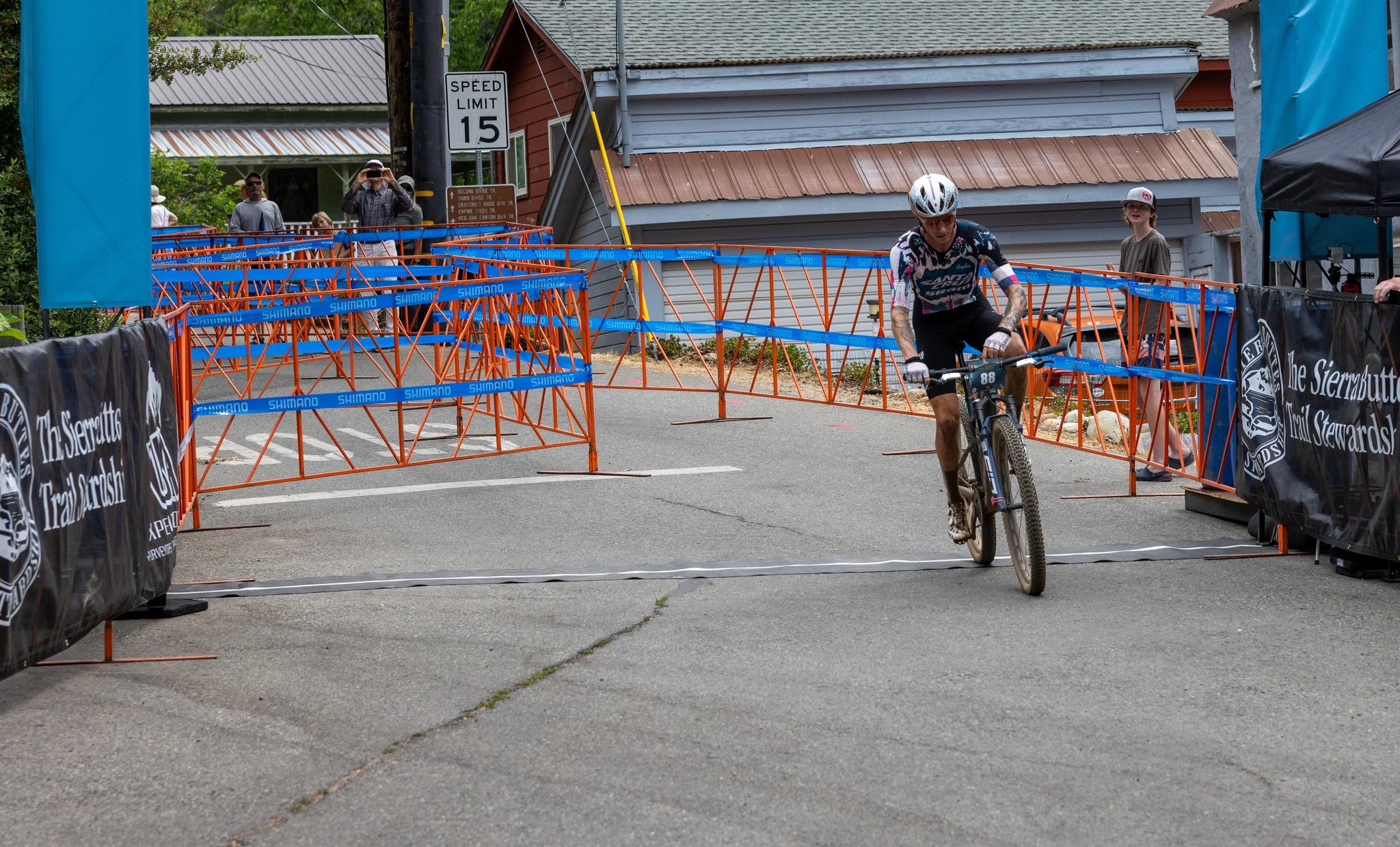 Swenson crosses the finish line in the cross-country race