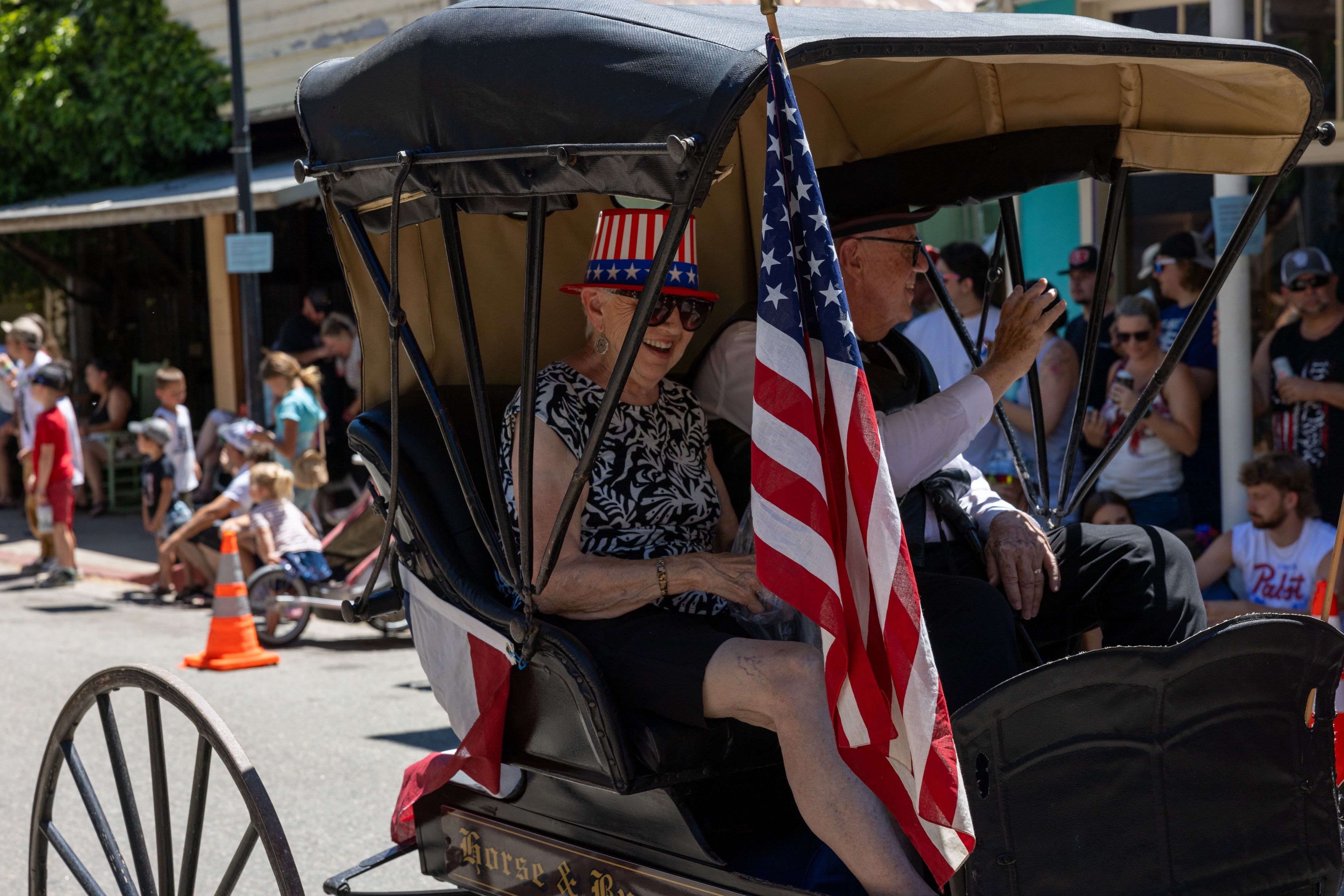 The lead vehicle in the parade pulls locals Frank and Betty Jo Lang