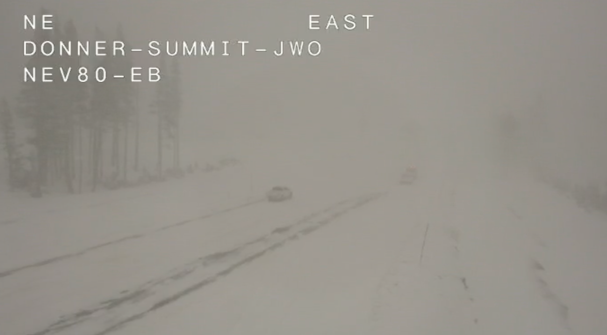 Traffic cameras on Interstate 80 show icy roads, high winds, and low visibility.