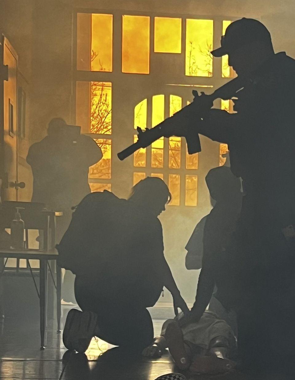 Participants secure and treat a simulated shooting victim