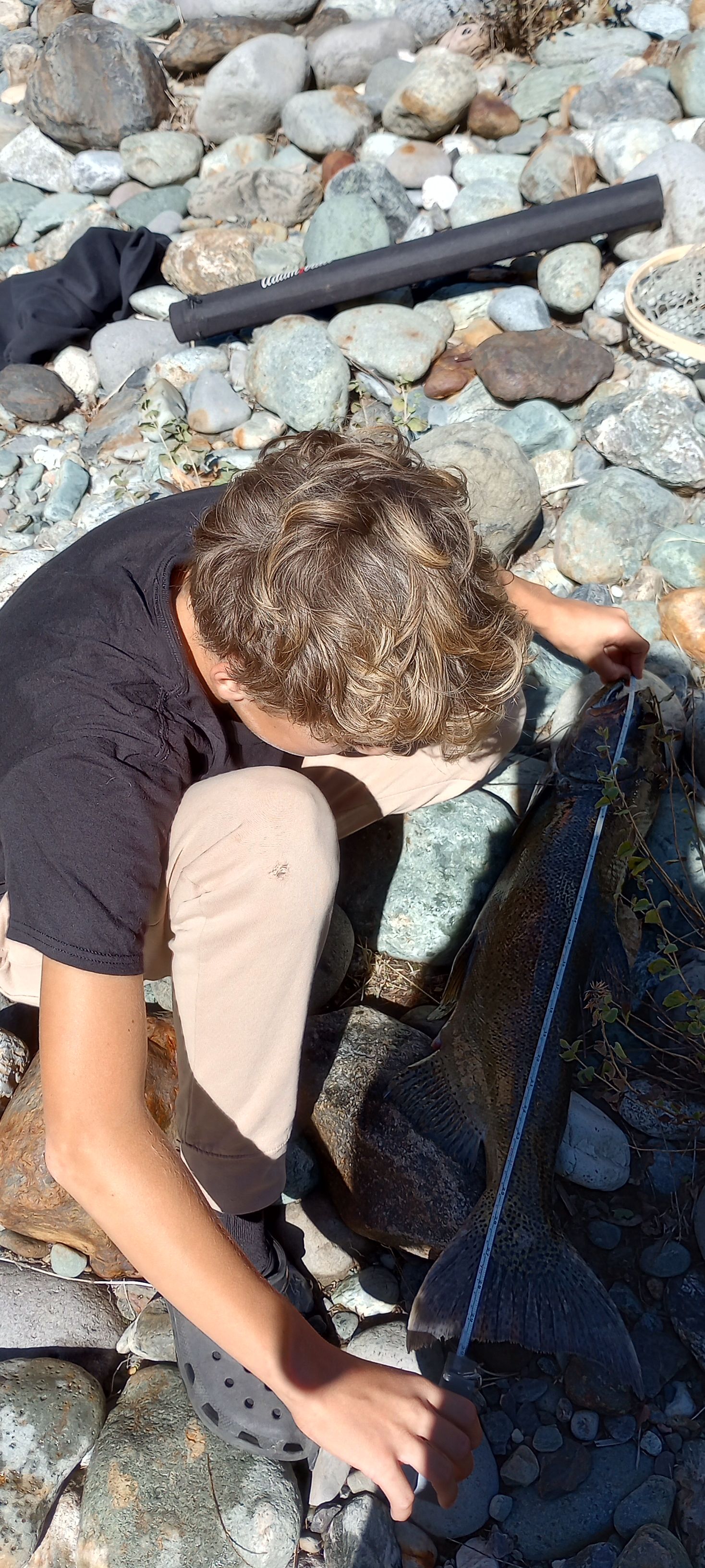 Drew measures his catch at Rocky Rest.