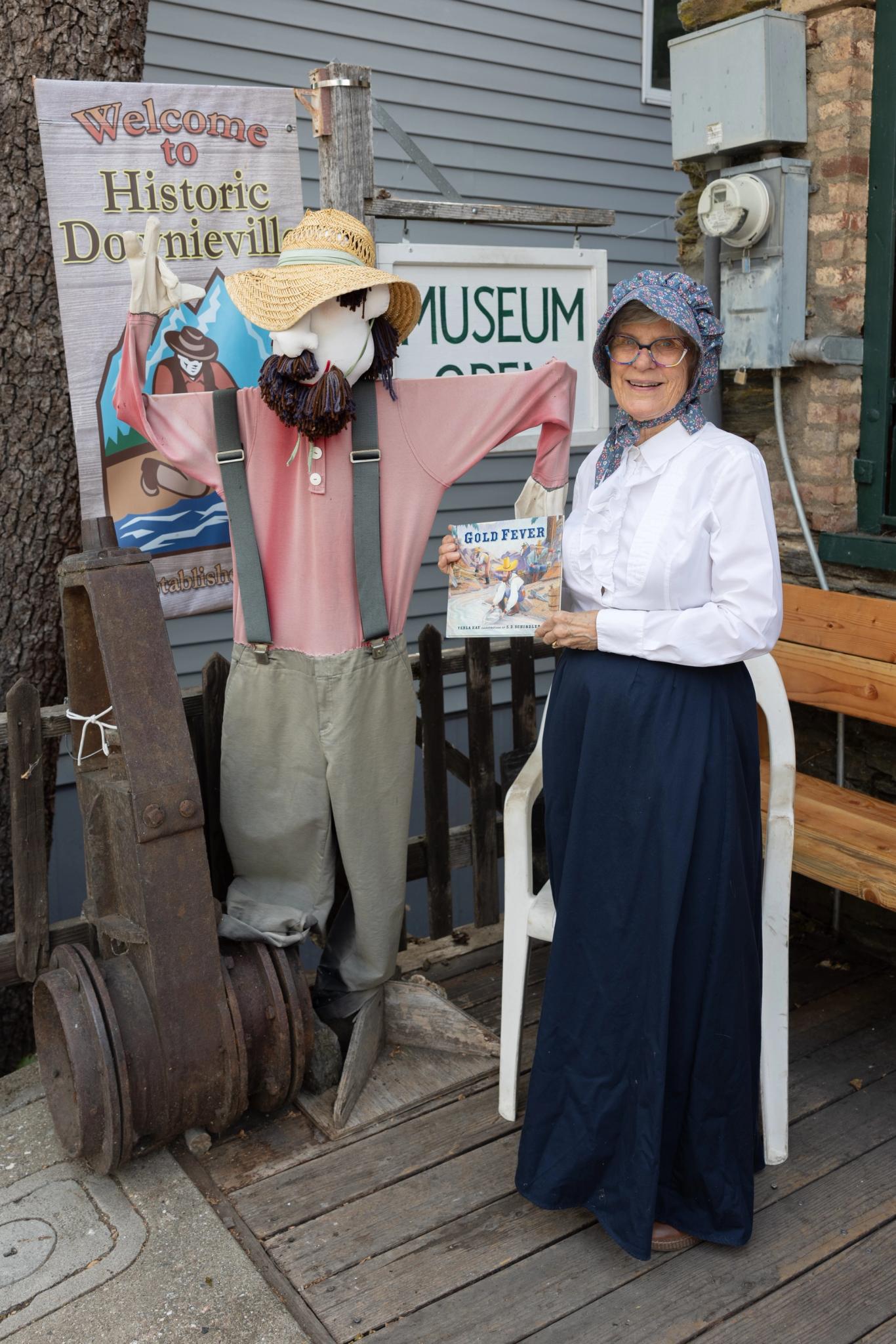 Karen Galan, docent of the Downieville Museum, dressed for the occasion and holding “Gold Fever” by Verla Kay