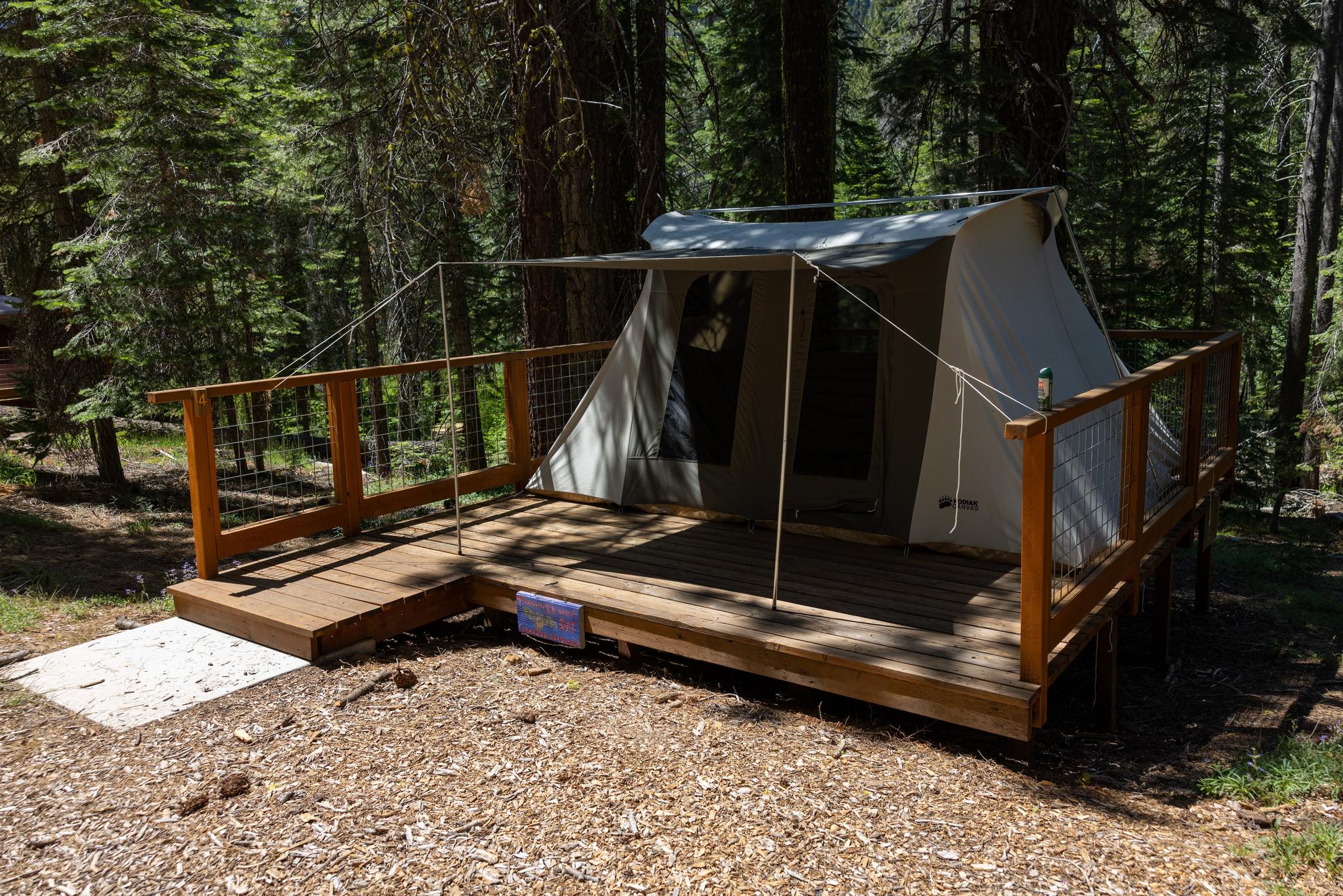 Student-reservable tents are set up on wooden platforms