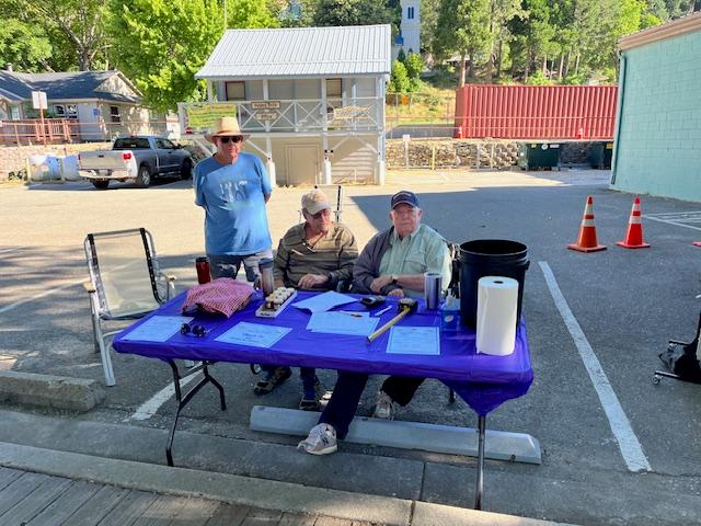 (Left to right) Former Lion, Jim Johnston, assisted Lions Richard Halliday and Mike Galan with the event