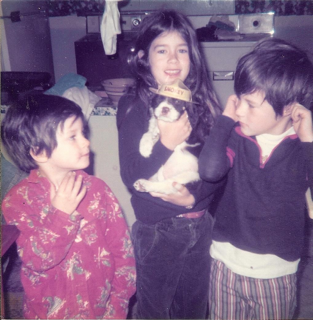 The author at age 8 holding baby Ruby. Brothers Jason on left and Steven on right.