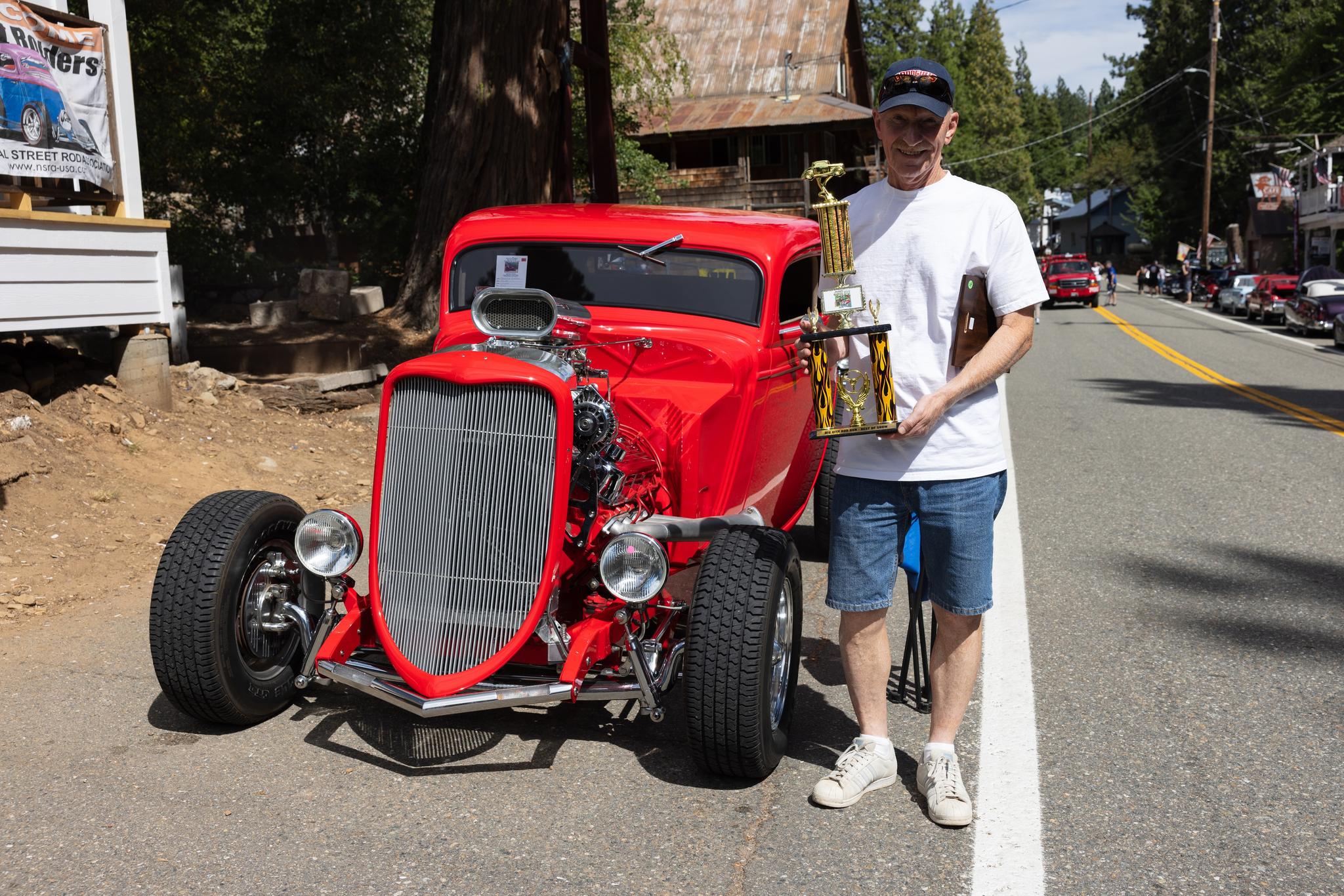 Charlie Catron next to his show-winning car