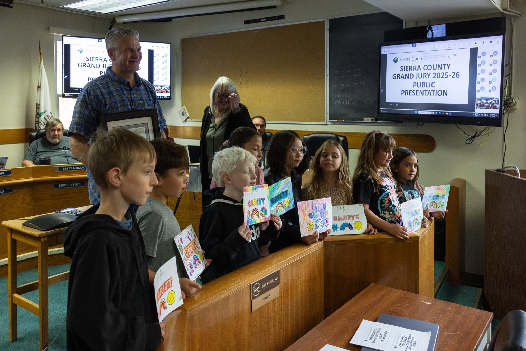 Downieville Elementary School students display cards they made thanking Garitt.