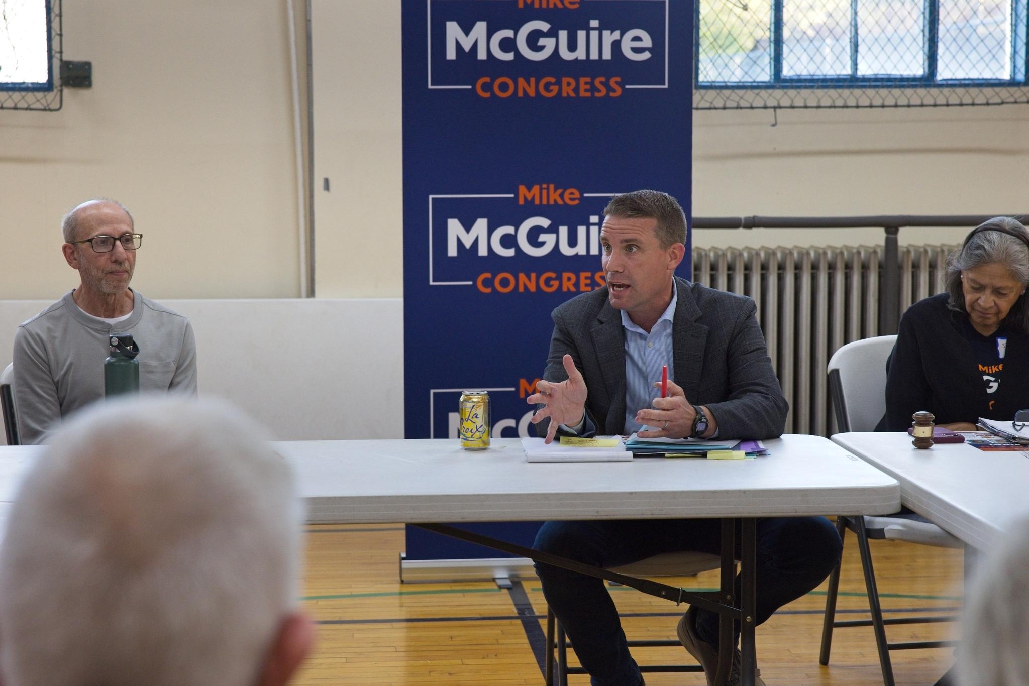 McGuire answers a question from an attendee.