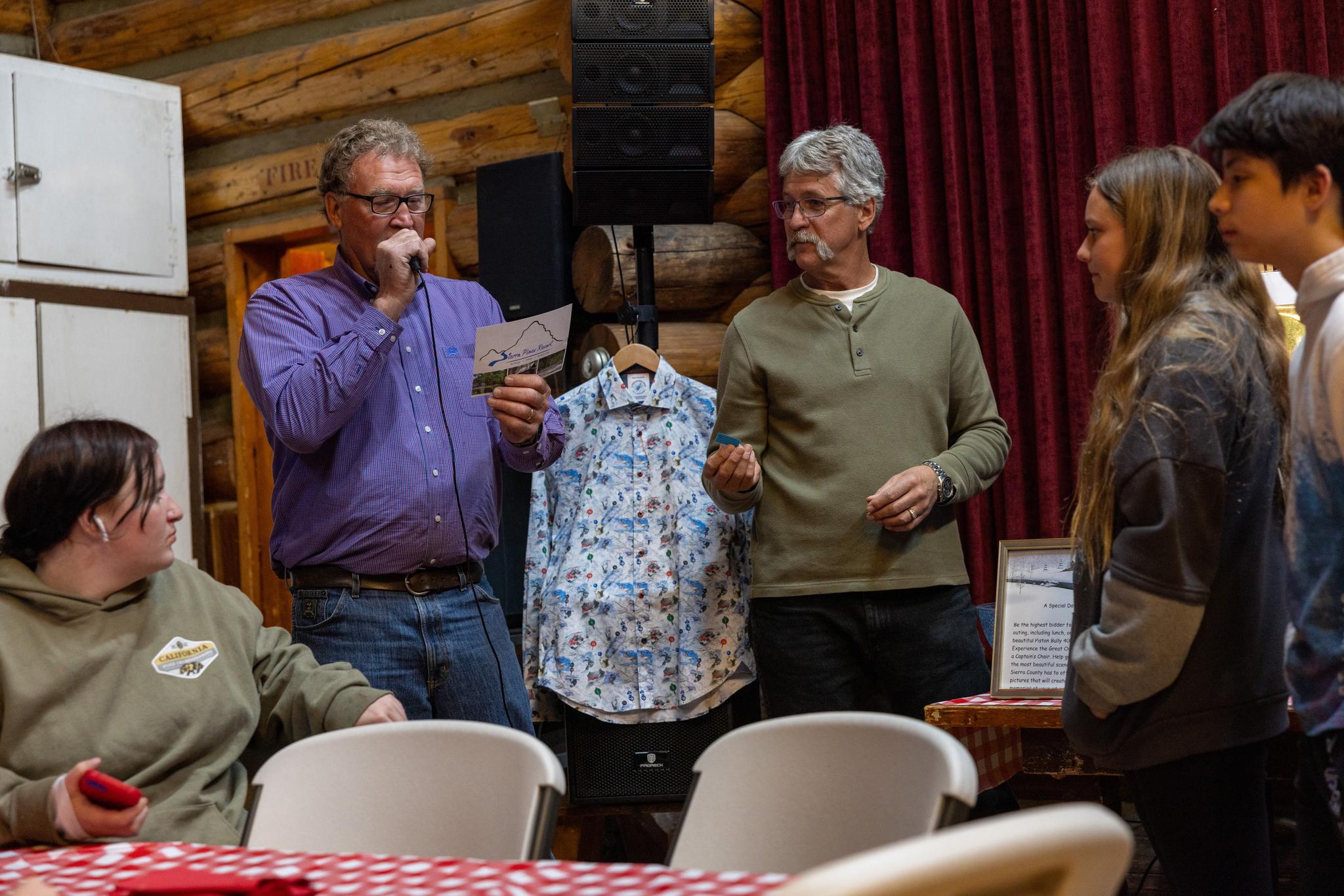 Dick Avery hosts the raffle and auction