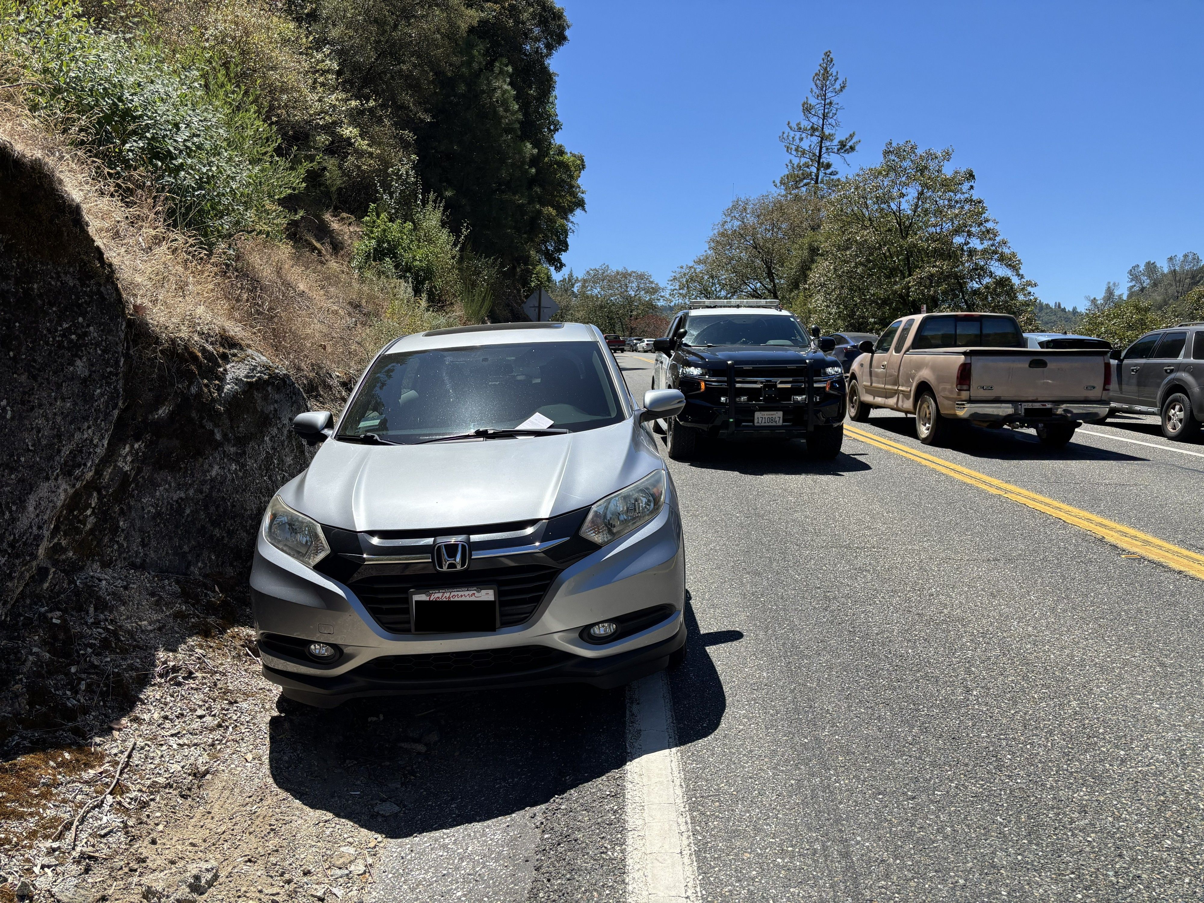Another vehicle parked illegally, touching the white fog line on Highway 49. Photo: CHP – Grass Valley