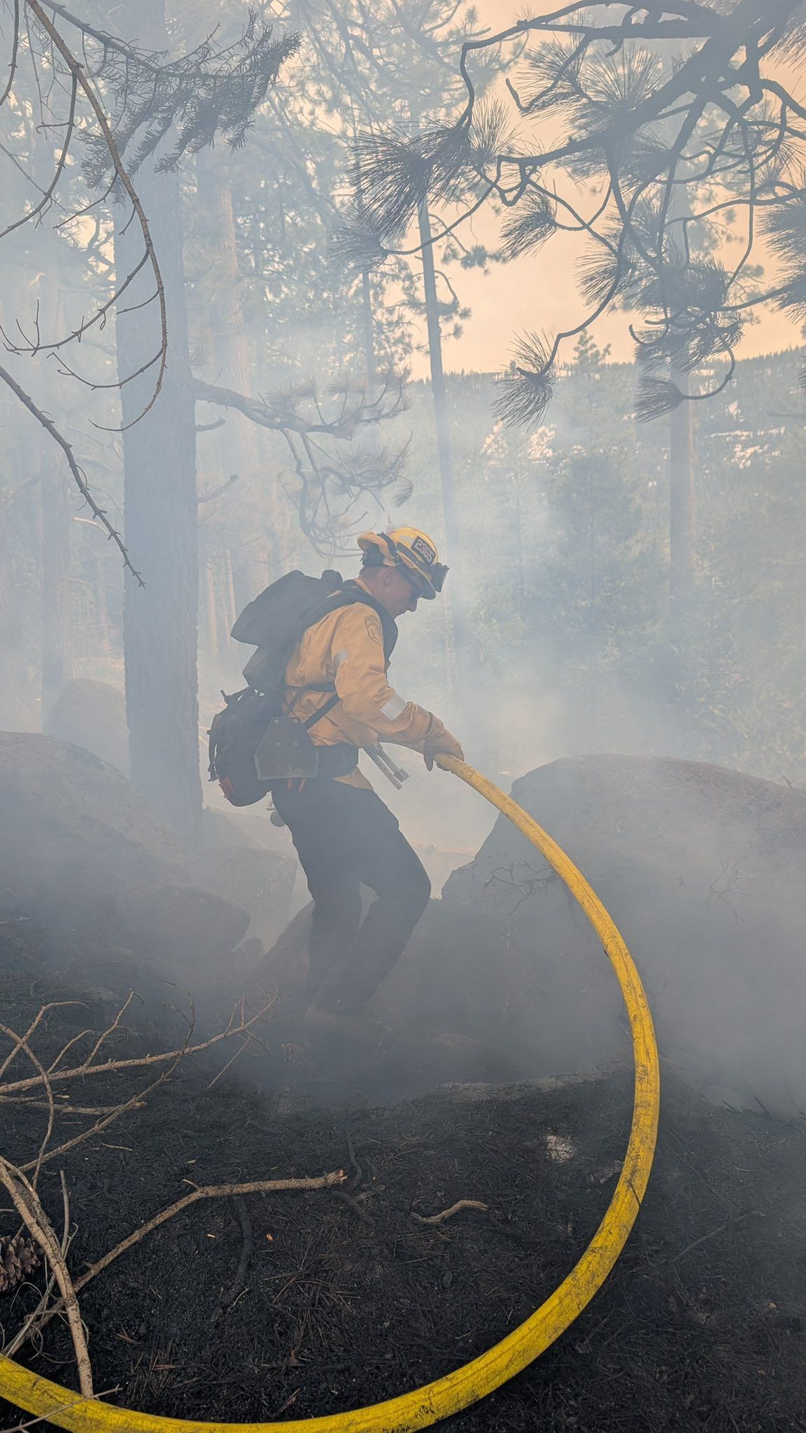 Another image of a firefighter working to control the burn shared by Cal Fire NEU.