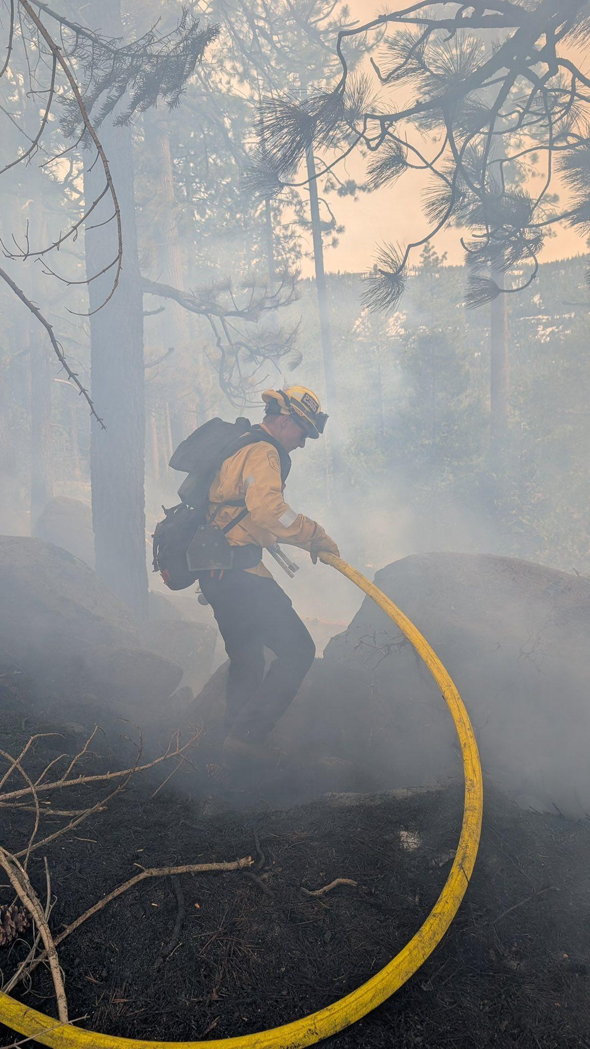 Another image of a firefighter working to control the burn shared by Cal Fire NEU.