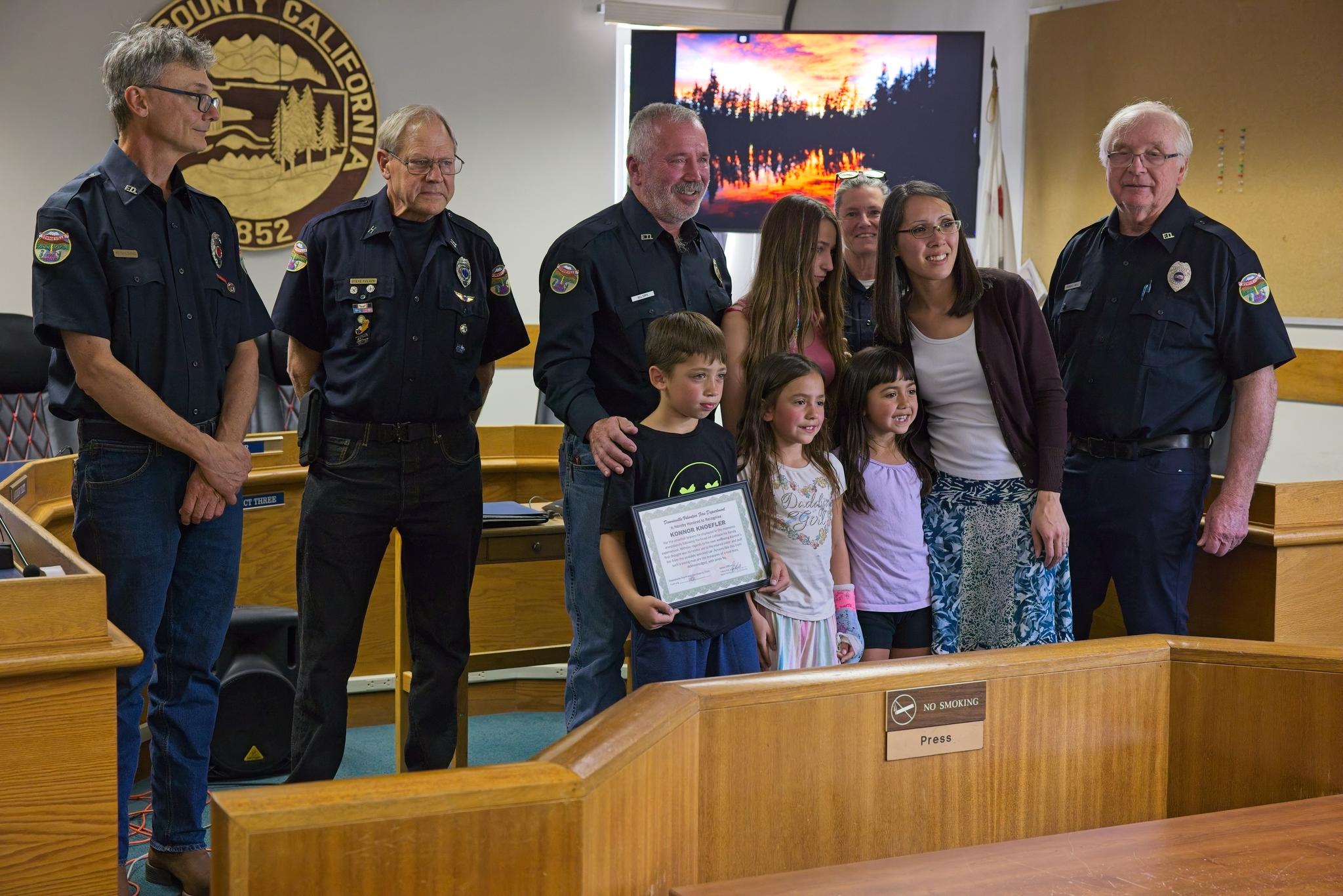 Konnor, his family, and Downieville Fire Department members.