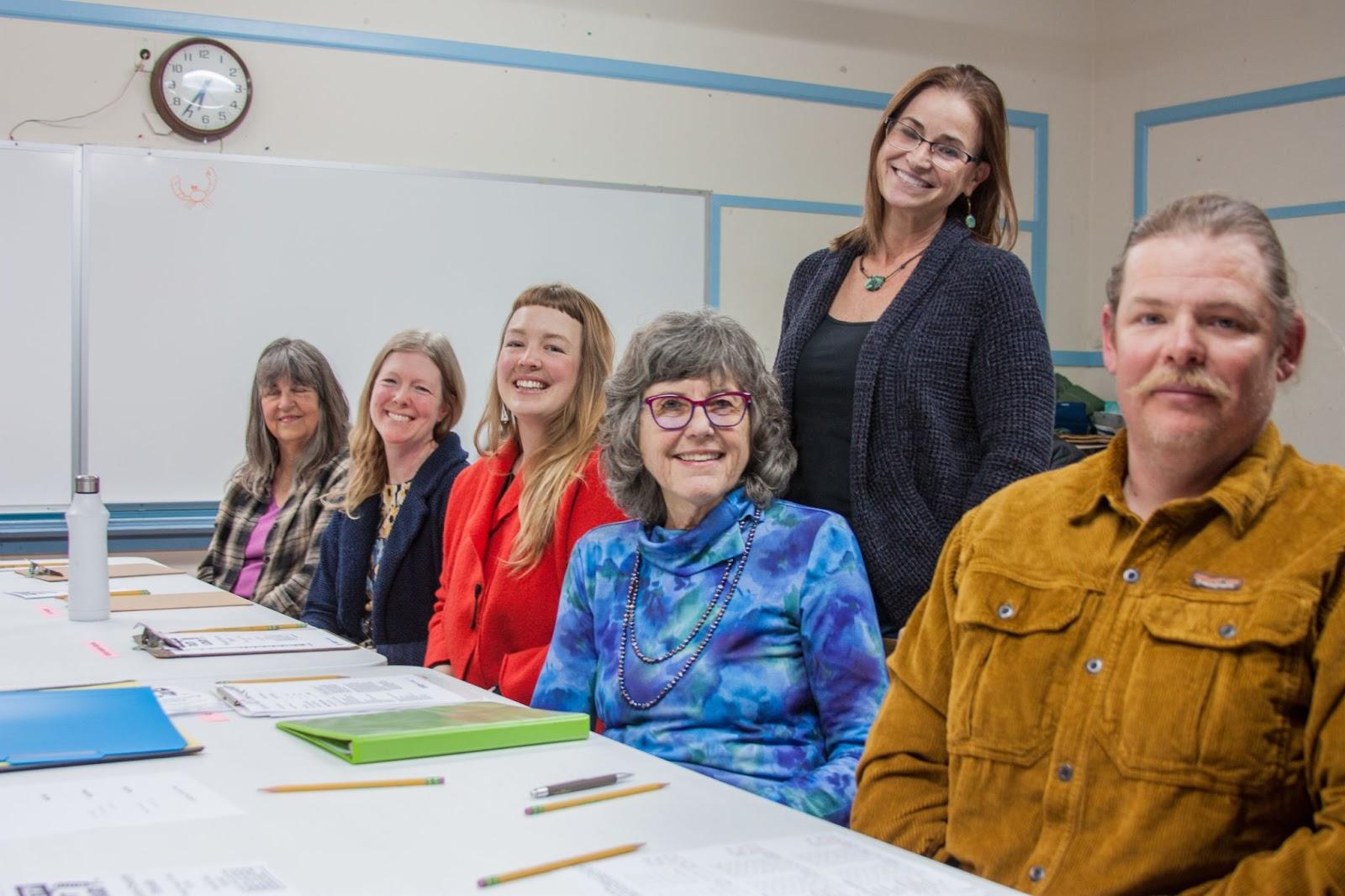 Sierra County Poetry Out Loud officials (left to right): Peggy Daigle; Jill Makoutz; Taylor Murphy-Geiszler; Cindy Ellsmore; Laura Marshall (standing); Joshua Geiszler.