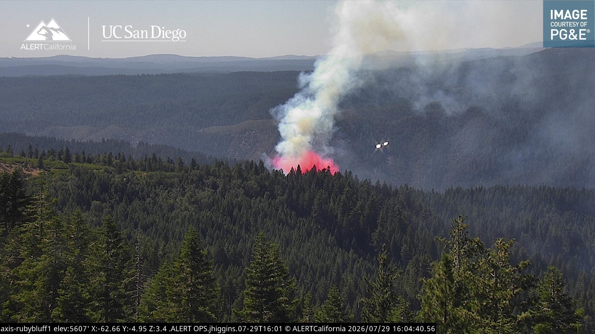 An air tanker drops fire retardant over the Pliocene Fire at 4:04 PM. Photo: ALERTCalifornia.