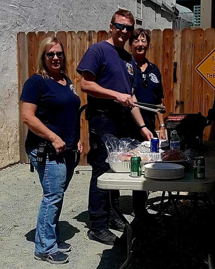 (Left to right) Diane Wharff, Tegan Harrington, and Jacie Epperson grilling hot dogs
