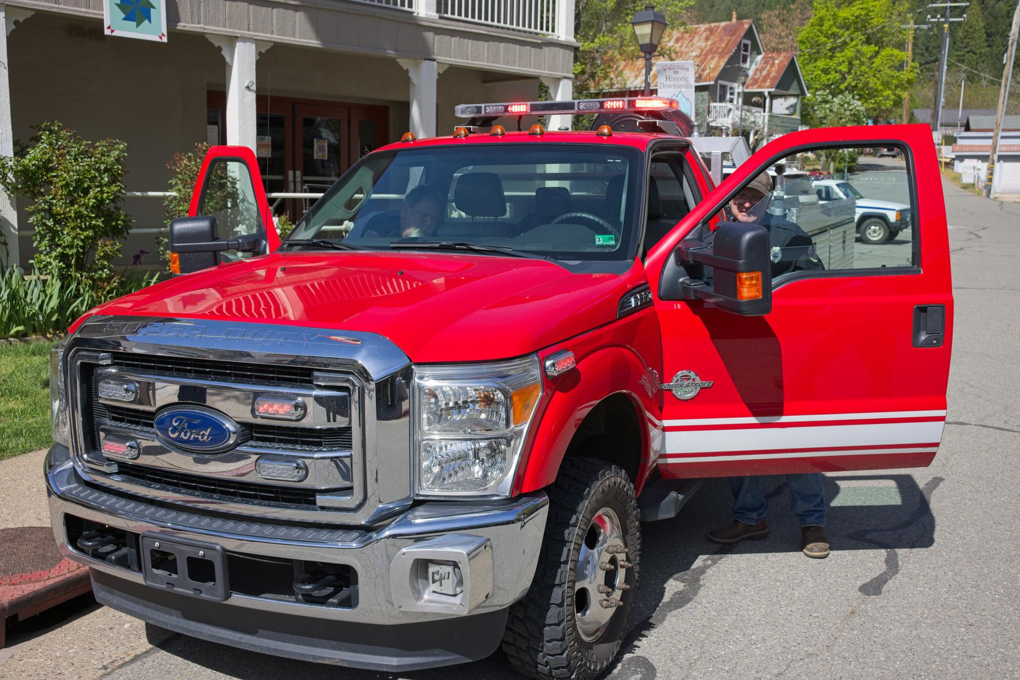 Fire Chief Robert Hall tests the emergency lights of the new fire engine.