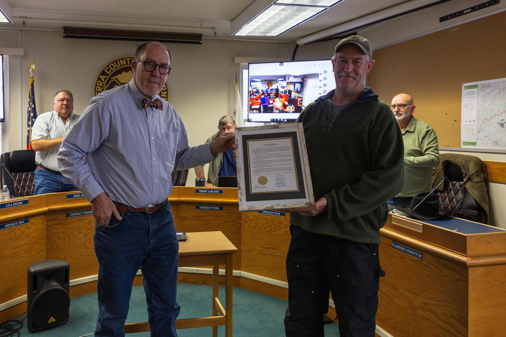 Supervisor Adams presented Dean Fischer with a Resolution of Appreciation commemorating his 20-year career with the county.