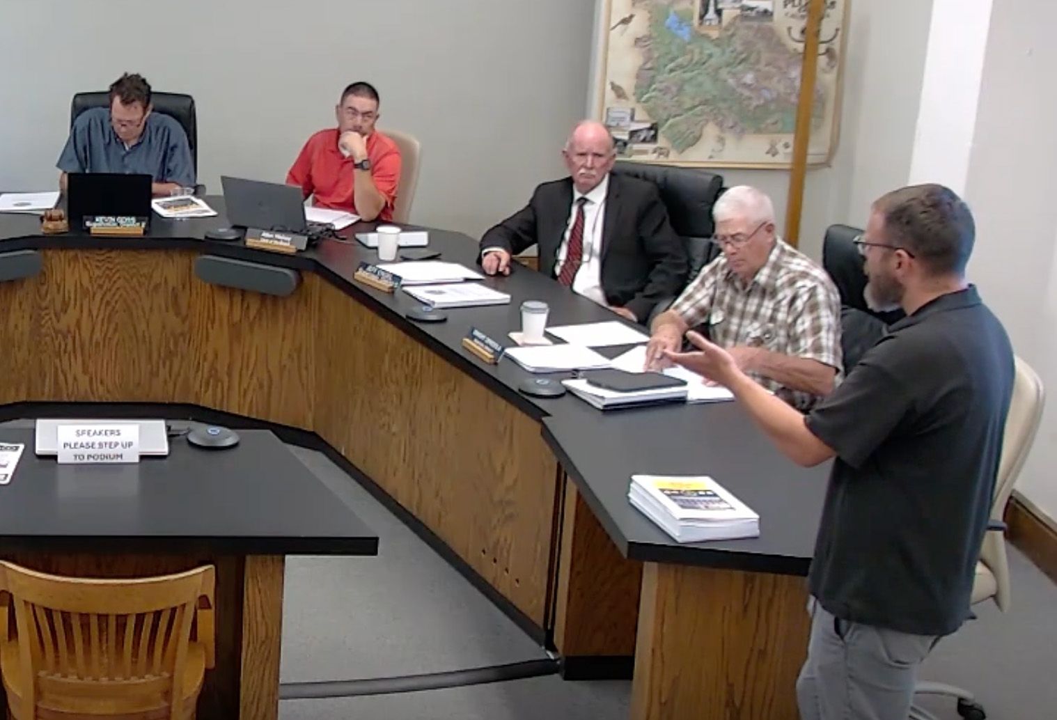 Zachary Gately updates the Plumas County Board on public meeting dates and locations.
