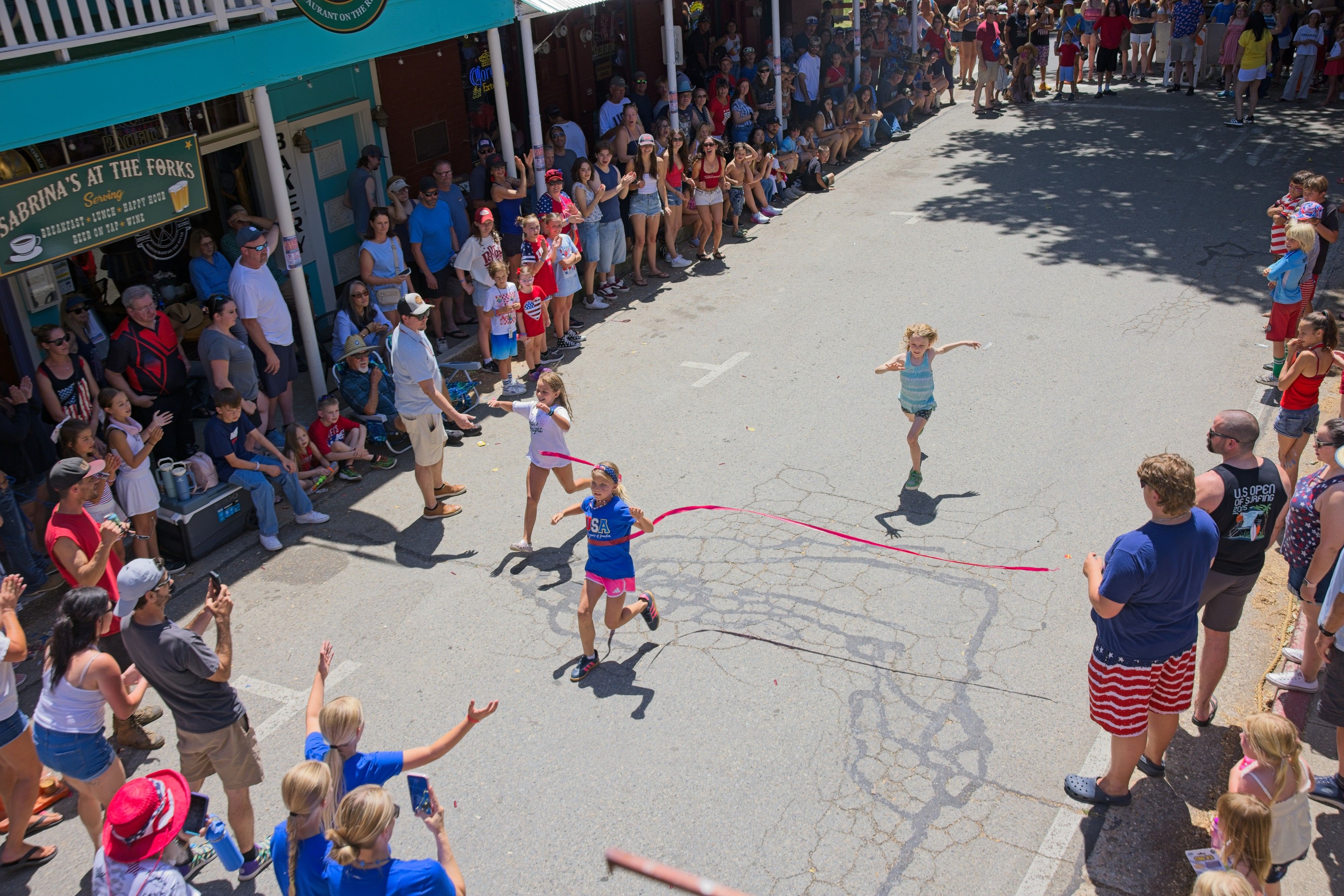 Children participate in the annual Fourth of July footraces.