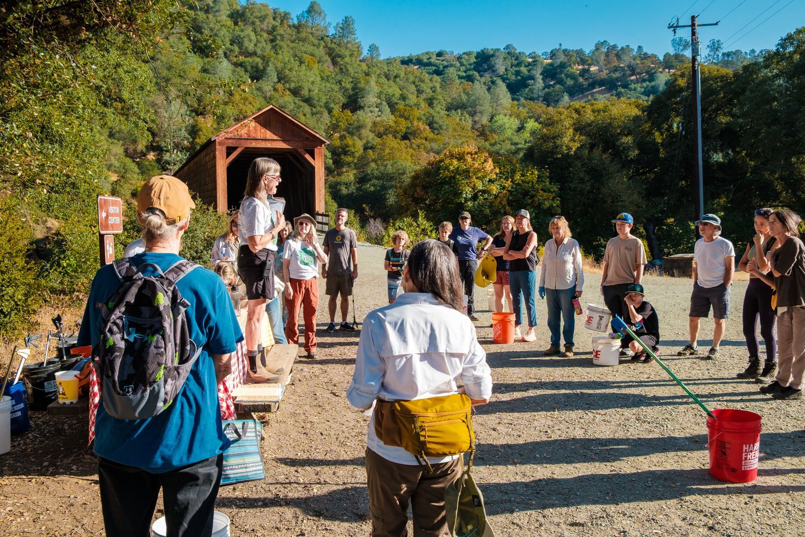 SYRCL Board Secretary Syd Brown gives volunteer orientation at the Bridgeport cleanup location. Photos courtesy of SYRCL.