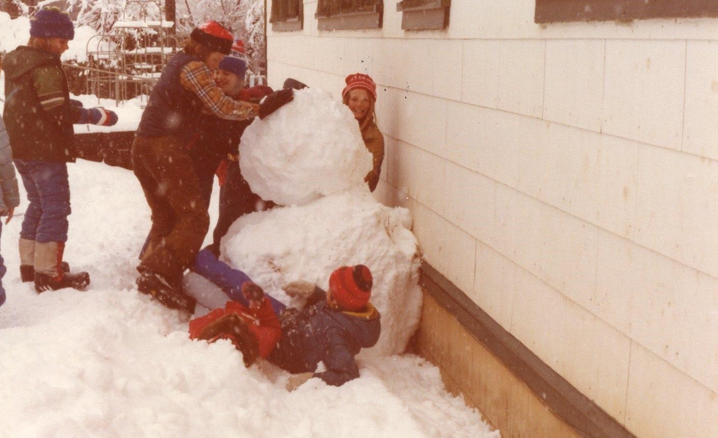 Kids playing in the yard at Alleghany School winter 1980-81. Girl closest to the building is Julie McGibben of Pike, the kid on the ground is Tonya Carter of Forest City.