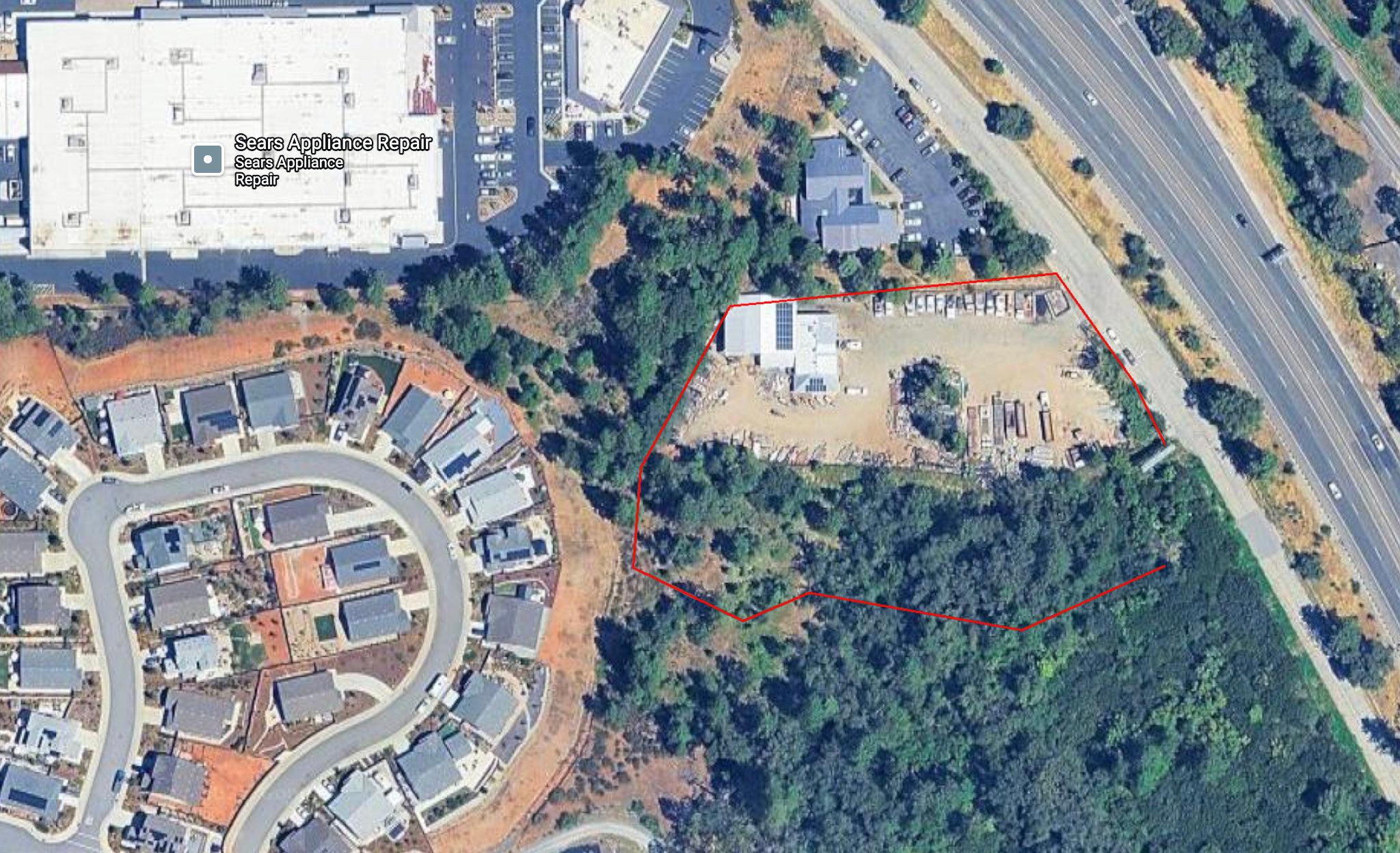 The proposed expansion pushes a contractor’s lot closer to residences on Berriman Loop.