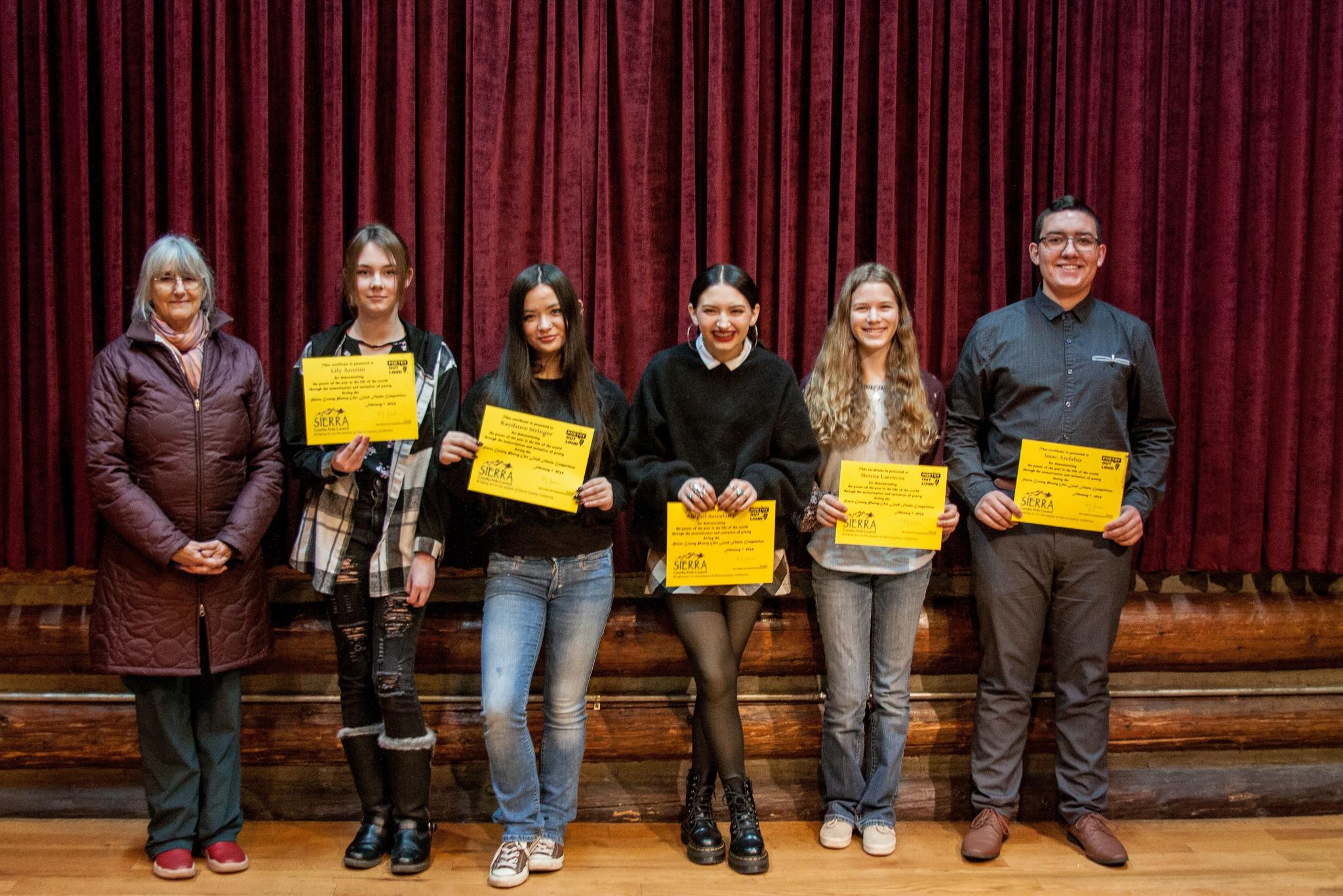2024 Poetry Out Loud winners. Left to Right: BJ Jordan, Sierra County Arts Council Executive Director, Lily Antrim, Kaydance Stringer, Abigail Sainsbury (3rd place), Sienna Larrucea (2nd place), Isaac Andaluz (1st place).
