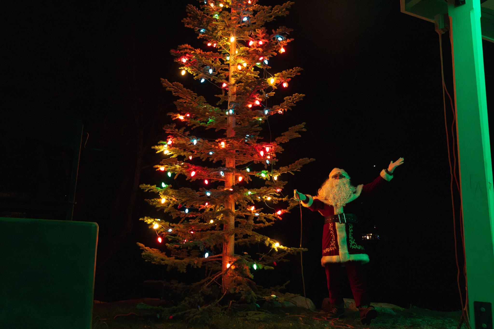 Santa lights the Downieville Christmas tree on Saturday evening. The lighting followed Holiday on Main and school plays.