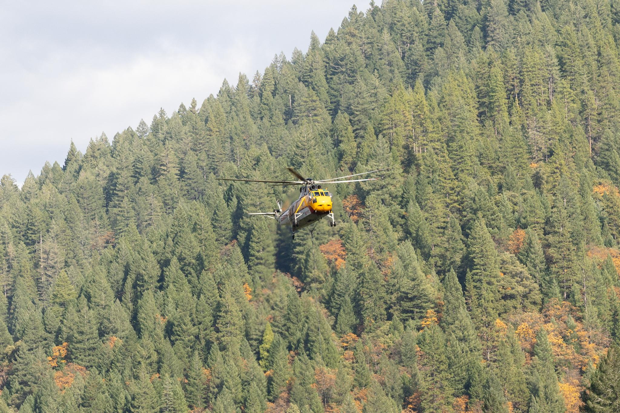 A logging helicopter takes off from a landing area near Downieville.