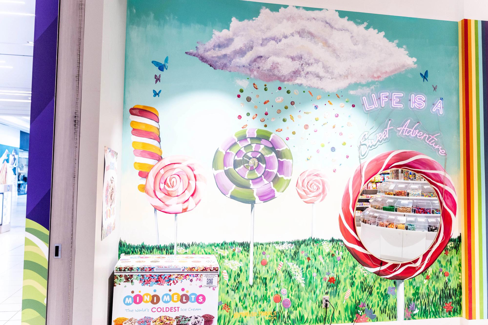 Candy cane cloud painted on a mall interior window 