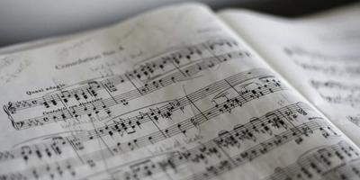 Headphones on the music theory sheets.