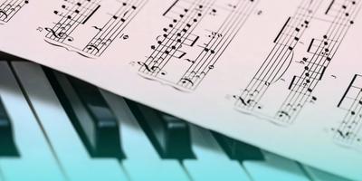 Piano music sheet and piano keys