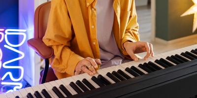 The students is practicing the piano