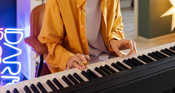 The students is practicing the piano