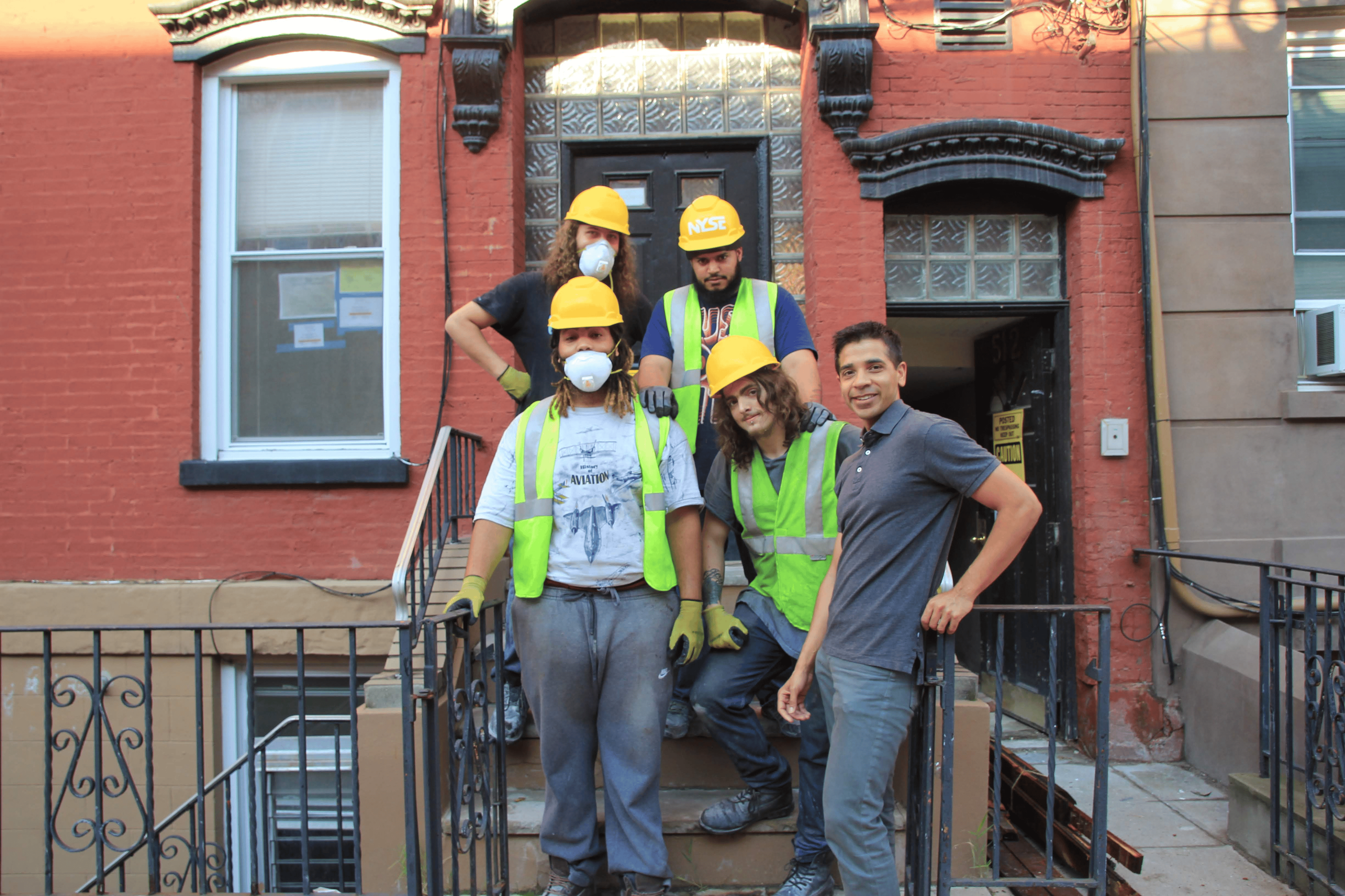 ATIF QADIR WITH CONSTRUCTION WORKERS AT 512 PARK AVENUE