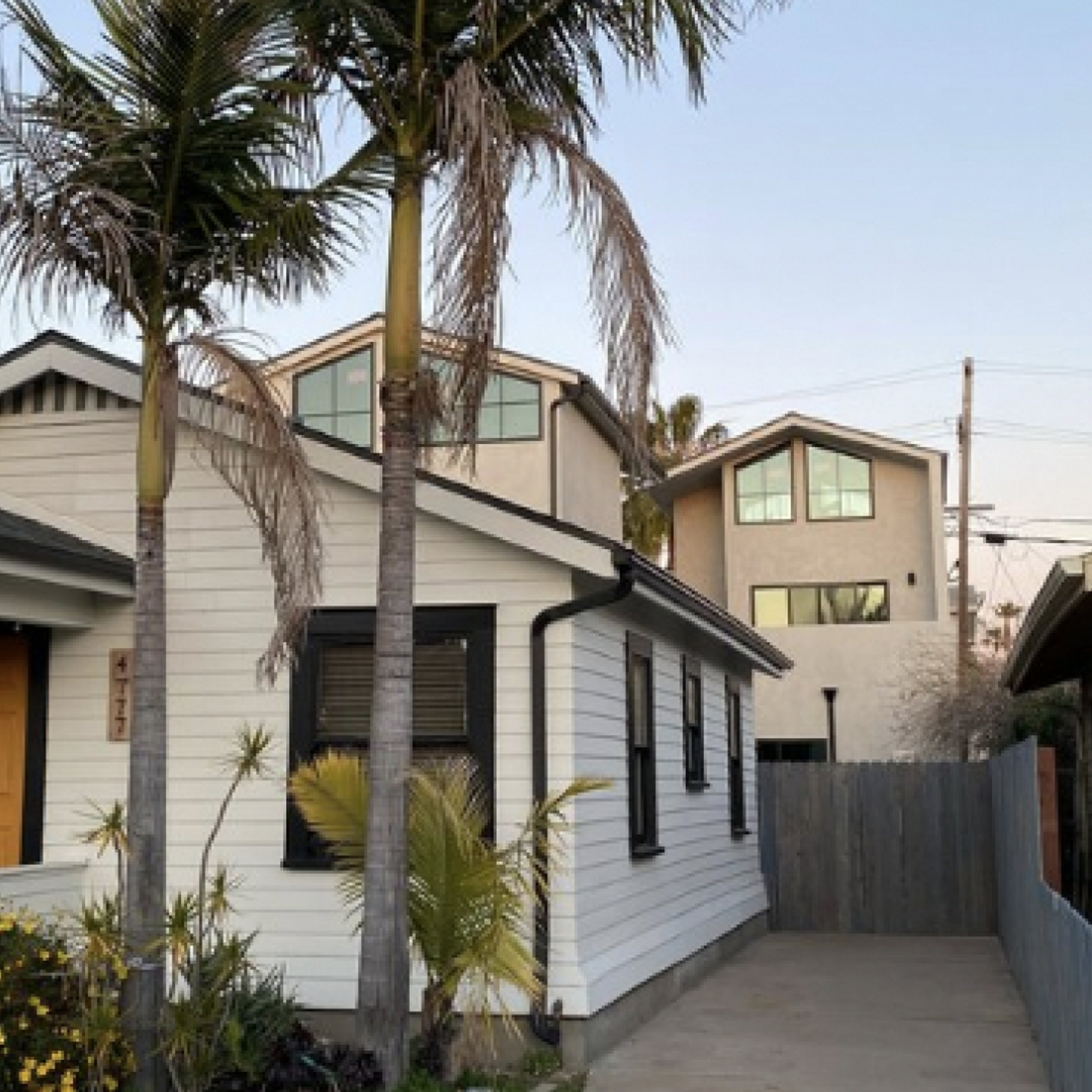 The ADU is tucked away in the backyard, barely visible from the street