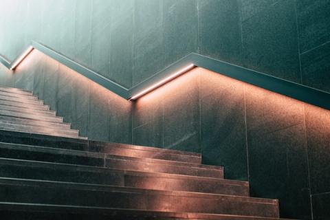 An interior staircase with metal railings