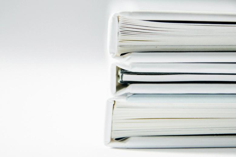 A stack of thick document folders