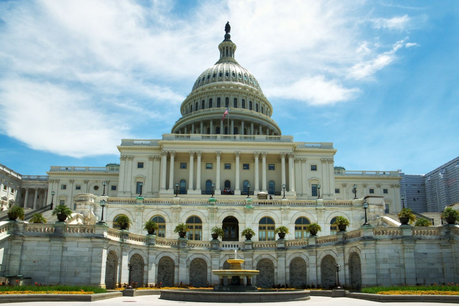 The United States Capitol with a fountain in the foreground