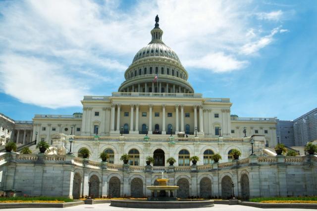 The United States Capitol with a fountain in the foreground