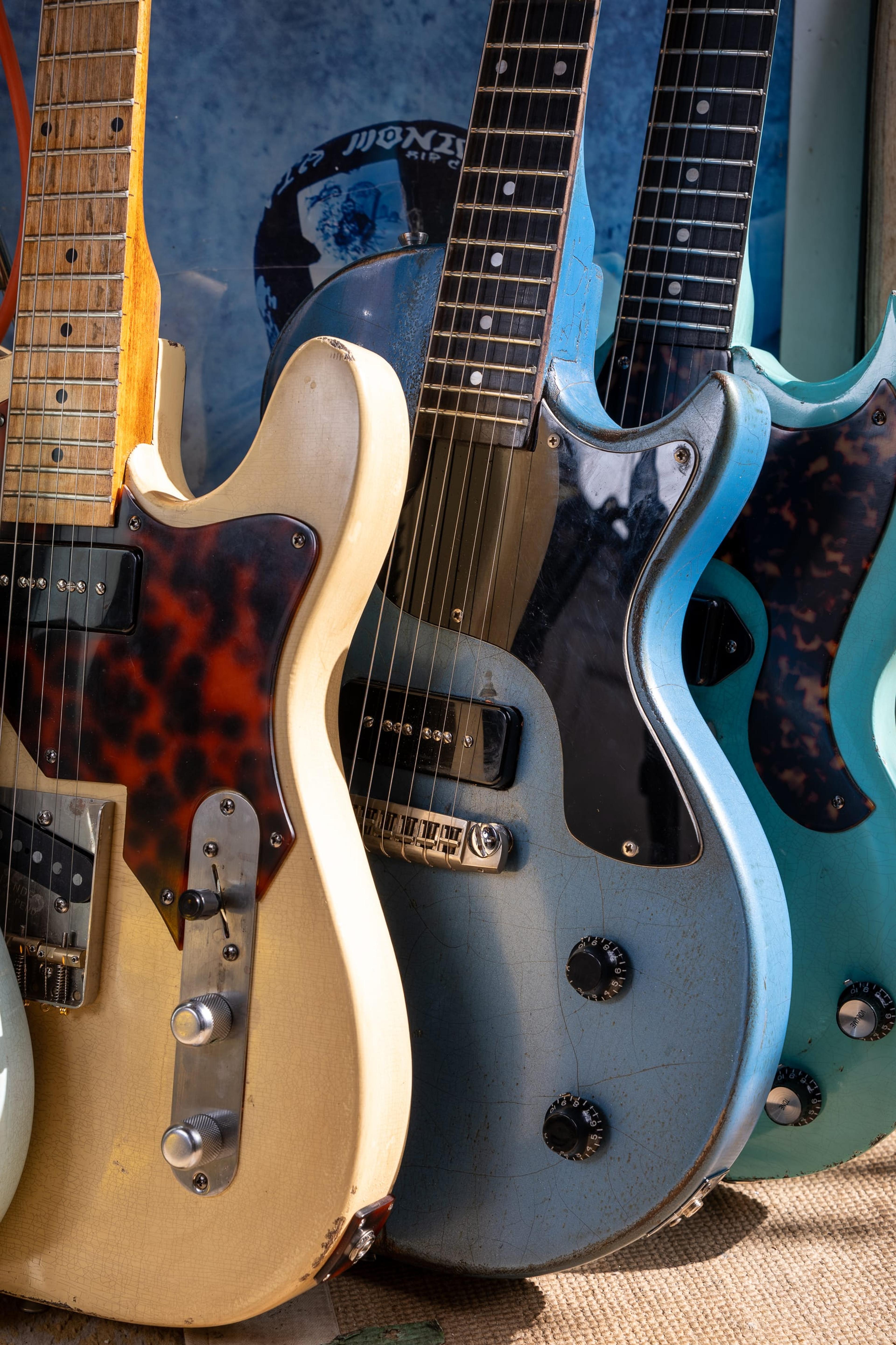 The Runaway, the 107, the Rebel and the Kid in a row in the shed doorway: surf green, vintage white, Pelham Blue and surf green again