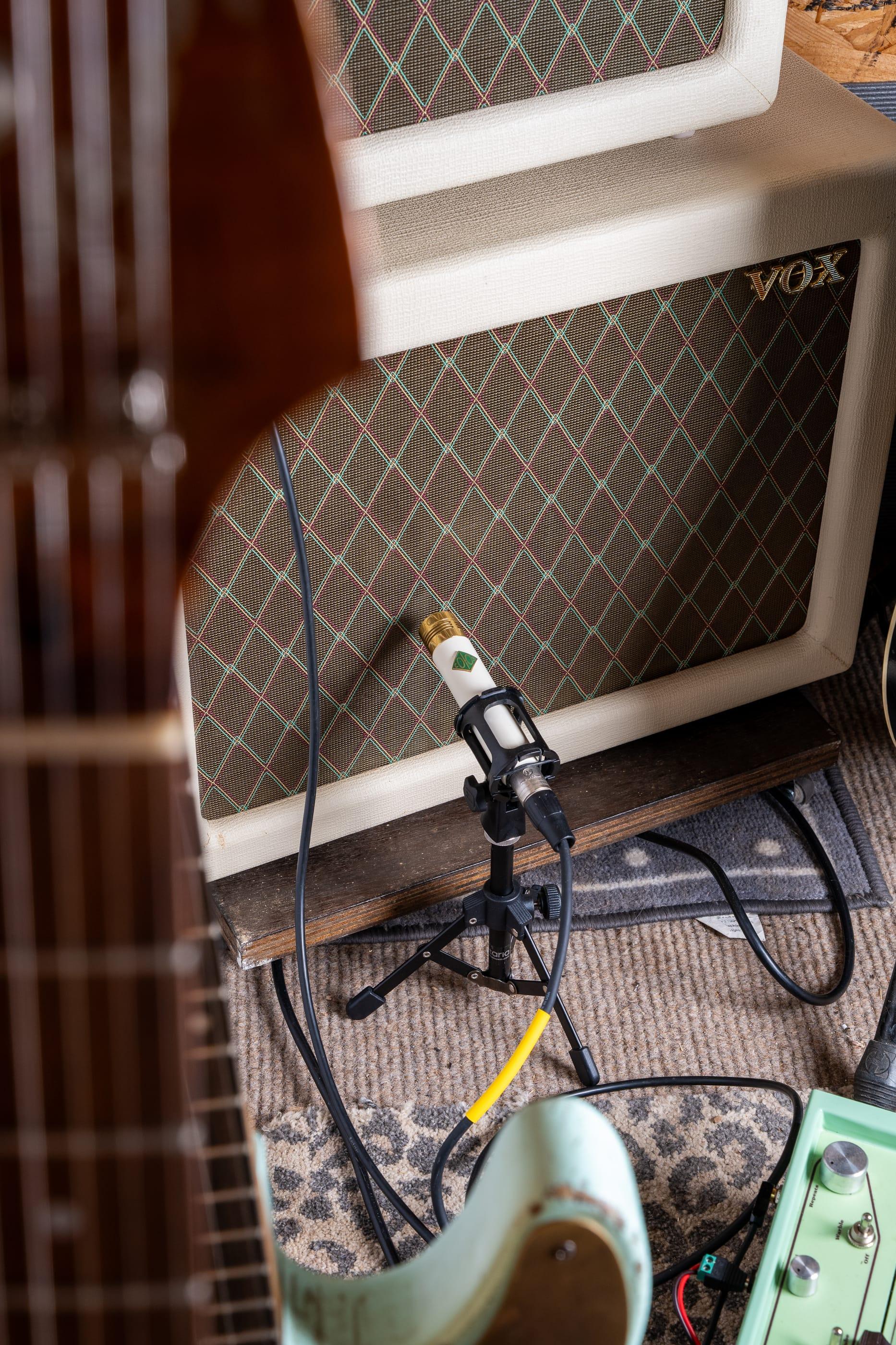 The Vox AC4 with the microphone on its mark, seen through a headstock