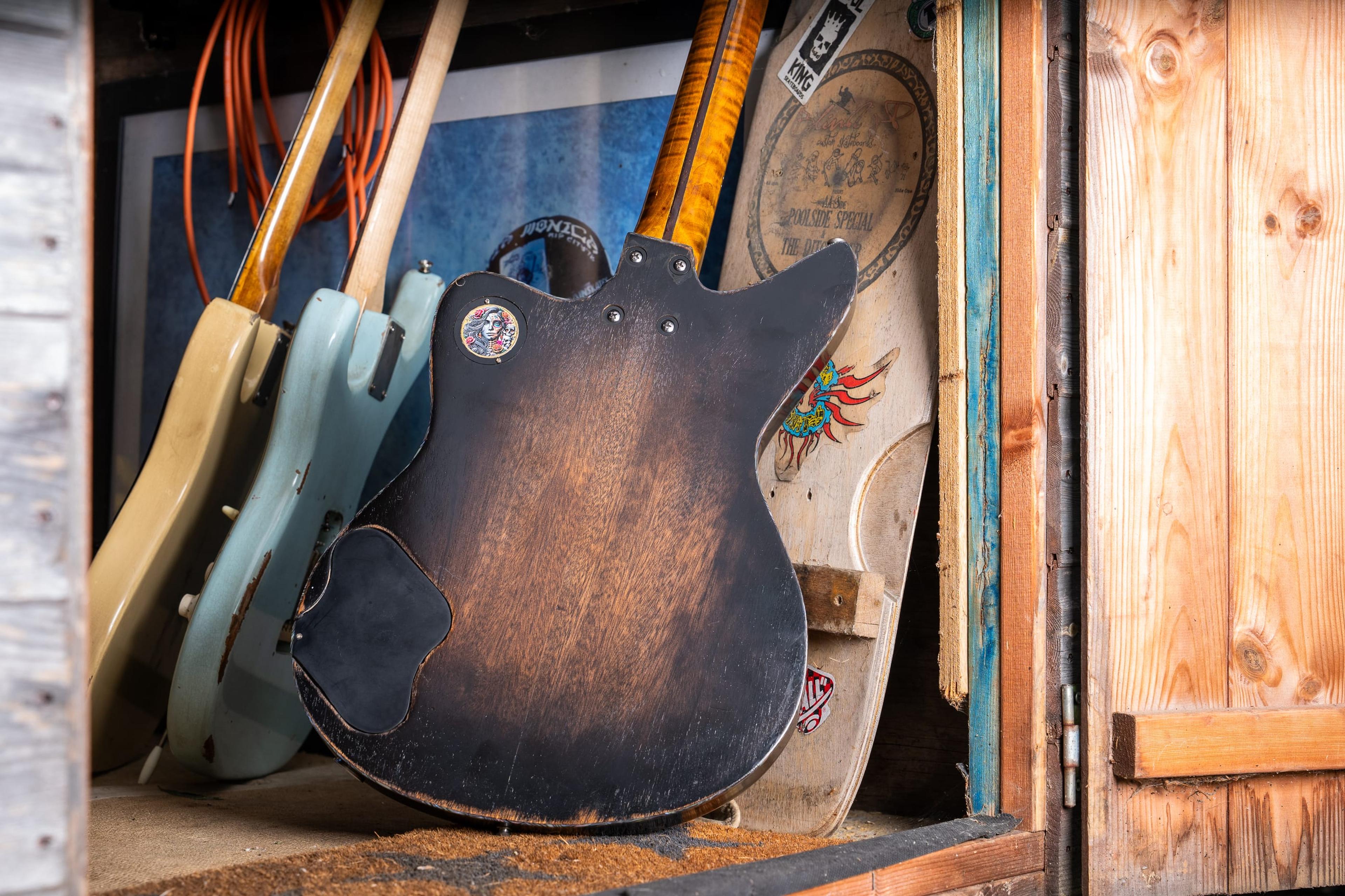 The back of the DeVille, worn, with the sound hole