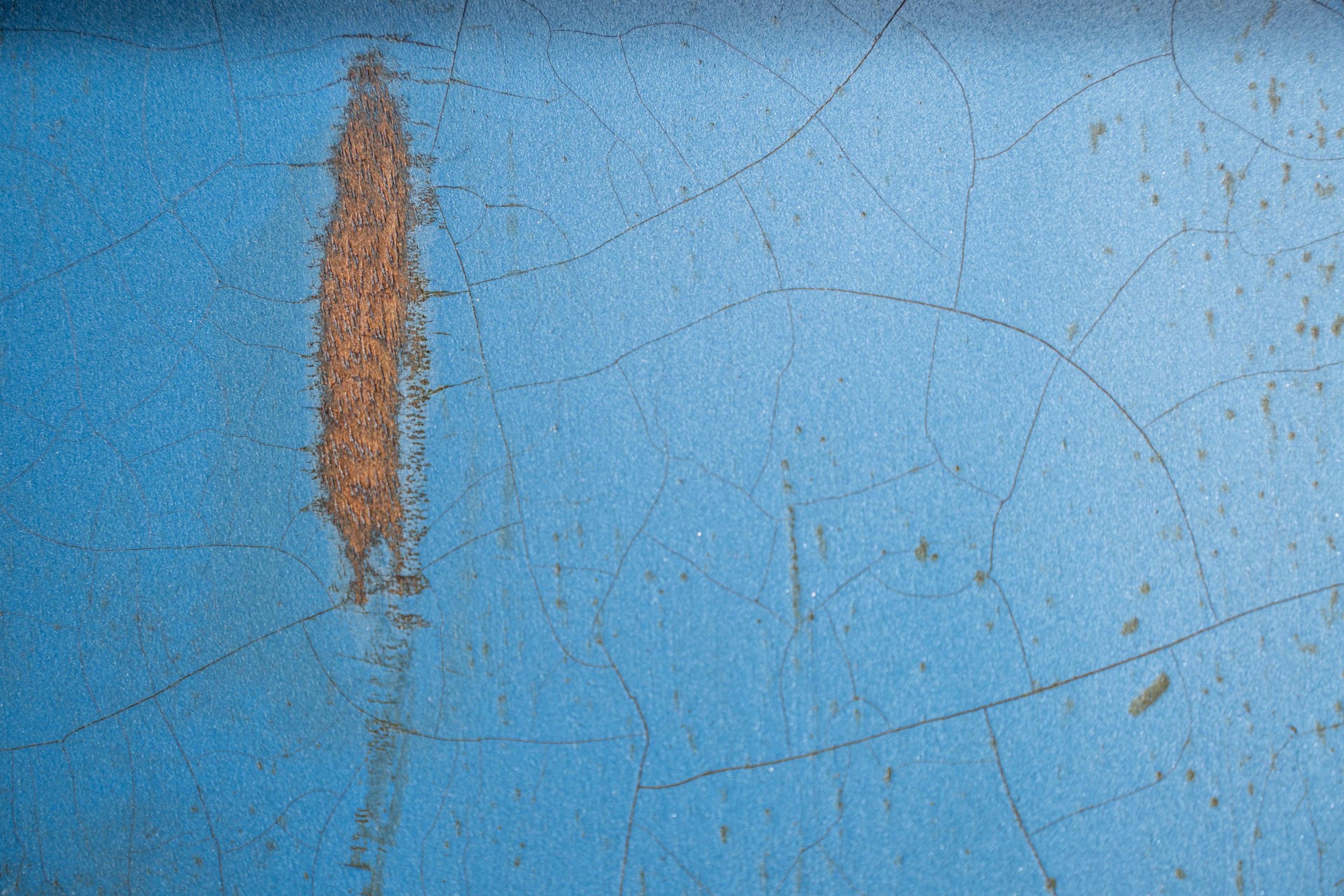 Craze lines across Pelham blue nitro, and a chip through to the wood