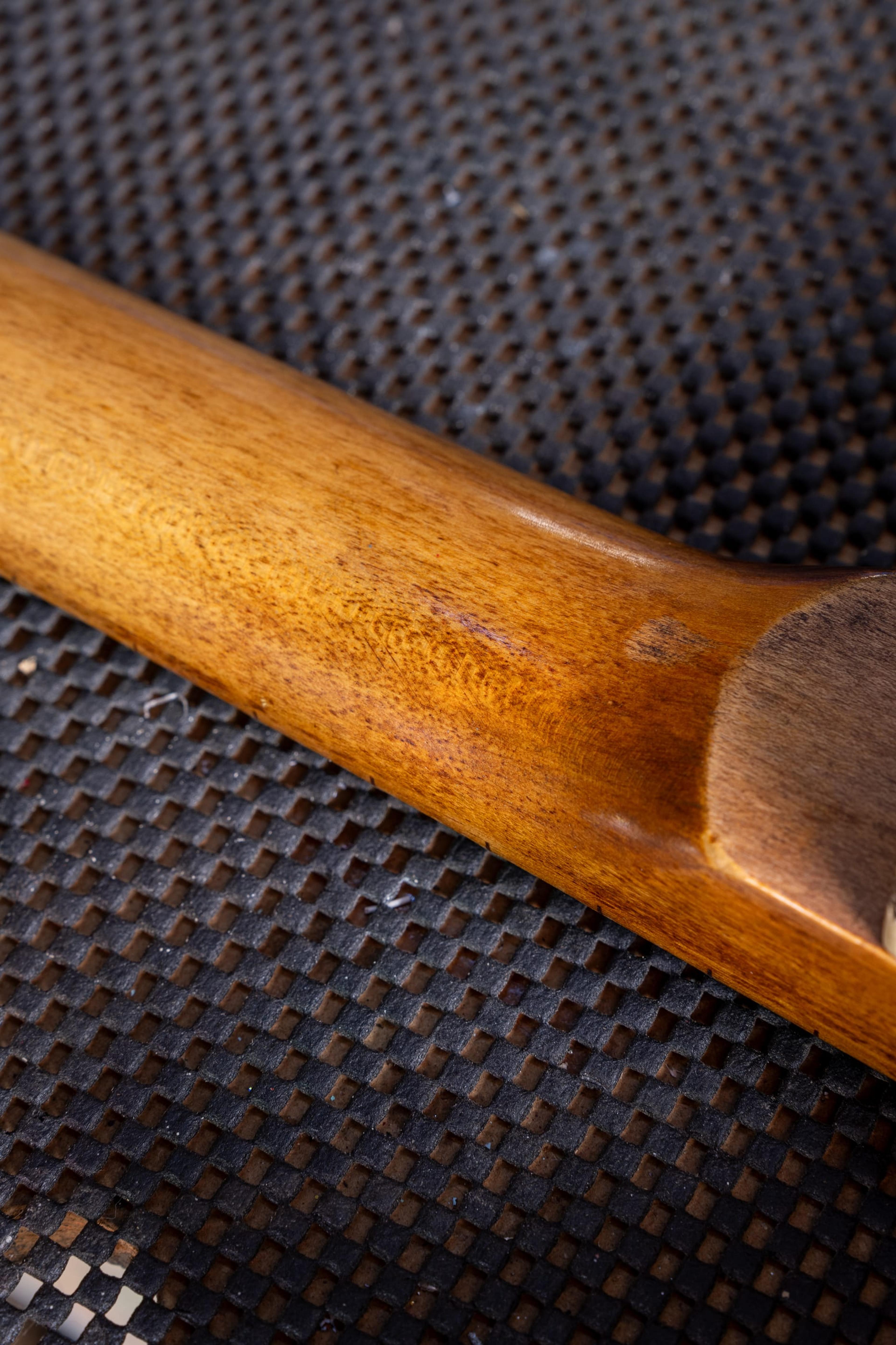 The bare wood on the back of the 107's neck